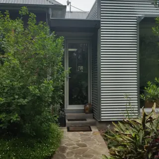 The new entrance provides a visual break between the new addition and original building