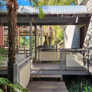 The new covered way connecting the principal dwelling with the original kitchen wing on the right