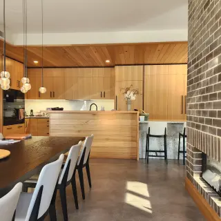 A double sided fireplace separates dining and living zones