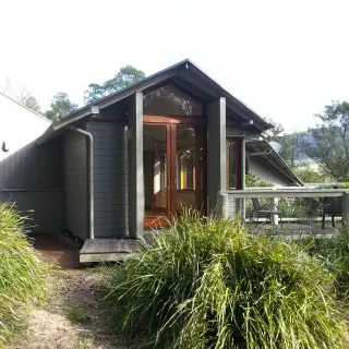 The main bedroom on the upper level opens onto a jetty-like deck