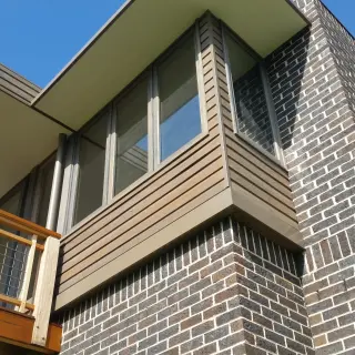 The brick base varies in height to further articulate the building form