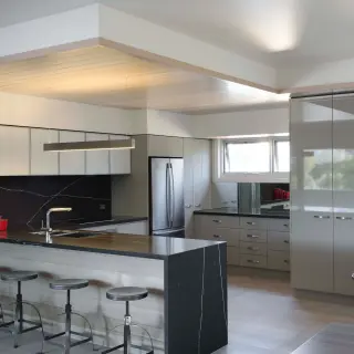 Varying ceiling heights defines the kitchen area