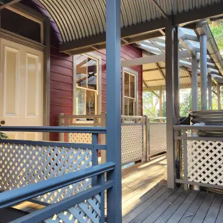 Handrail and lattice balustrade panels match the original detail