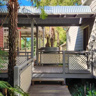 The new covered way connecting the principal dwelling with the original kitchen wing on right