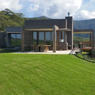 The building opens onto the landscape at floor level
